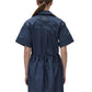 Person facing away, wearing the Simkhai Dawson Shirt Dress in navy blue. The dress features short sleeves, a collared neckline, and an elastic waist. Hair is tied back in a low ponytail.