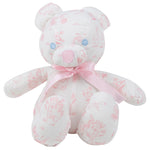A white and pink patterned teddy bear with blue button eyes and a pink ribbon bow around its neck sits upright against a plain background. The Bradley Bear - Sir Propers Sweet Arrival by The Beaufort Bonnet Company makes an adorable baby shower gift.