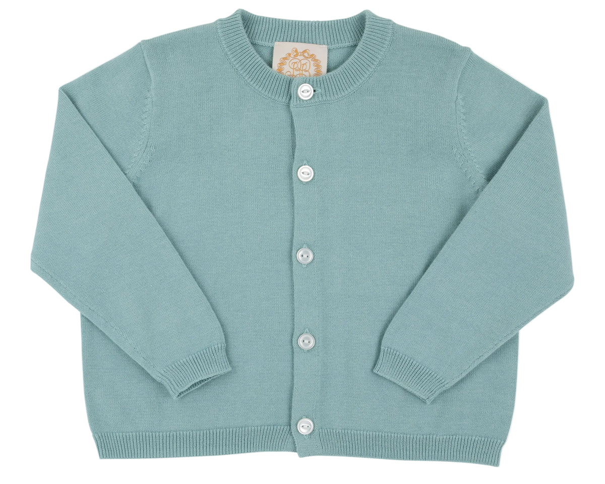 The Baby Girls’ and Girls’ Cambridge Cardigan by The Beaufort Bonnet Company is shown in light blue, featuring pearlized white buttons. Displayed flat against a white background, the cardigan has long sleeves and a round neckline.