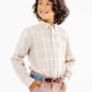 A young child with curly hair, wearing The Beaufort Bonnet Company Boys’ Flannel Dean’s List Dress Shirt, tan pants, and a belt, stands with hands in pockets, smiling and looking to the side against a white background.