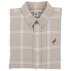 A beige Boys’ Flannel Dean’s List Dress Shirt from The Beaufort Bonnet Company with a pelican logo on the chest, neatly folded with the collar and buttons visible.