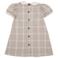 The Beaufort Bonnet Company’s Baby Girls’ and Girls’ Francene Frock in Thompson Park Plaid features a beige and white plaid pattern, a classic white Peter Pan collar, charming puffed short sleeves, knee-length cut, and a row of front buttons for timeless style.
