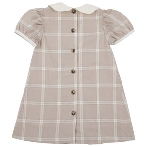 The Beaufort Bonnet Company’s Baby Girls’ and Girls’ Francene Frock in Thompson Park Plaid features a beige and white plaid pattern, a classic white Peter Pan collar, charming puffed short sleeves, knee-length cut, and a row of front buttons for timeless style.