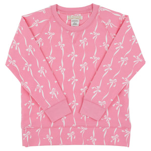 Baby Girls’ and Girls’ French Terry Cassidy Comfy Crewneck from The Beaufort Bonnet Company, shown in pink with a delightful Bow Print pattern of white bows and ribbons, displayed flat with the long sleeves crossed over the front.