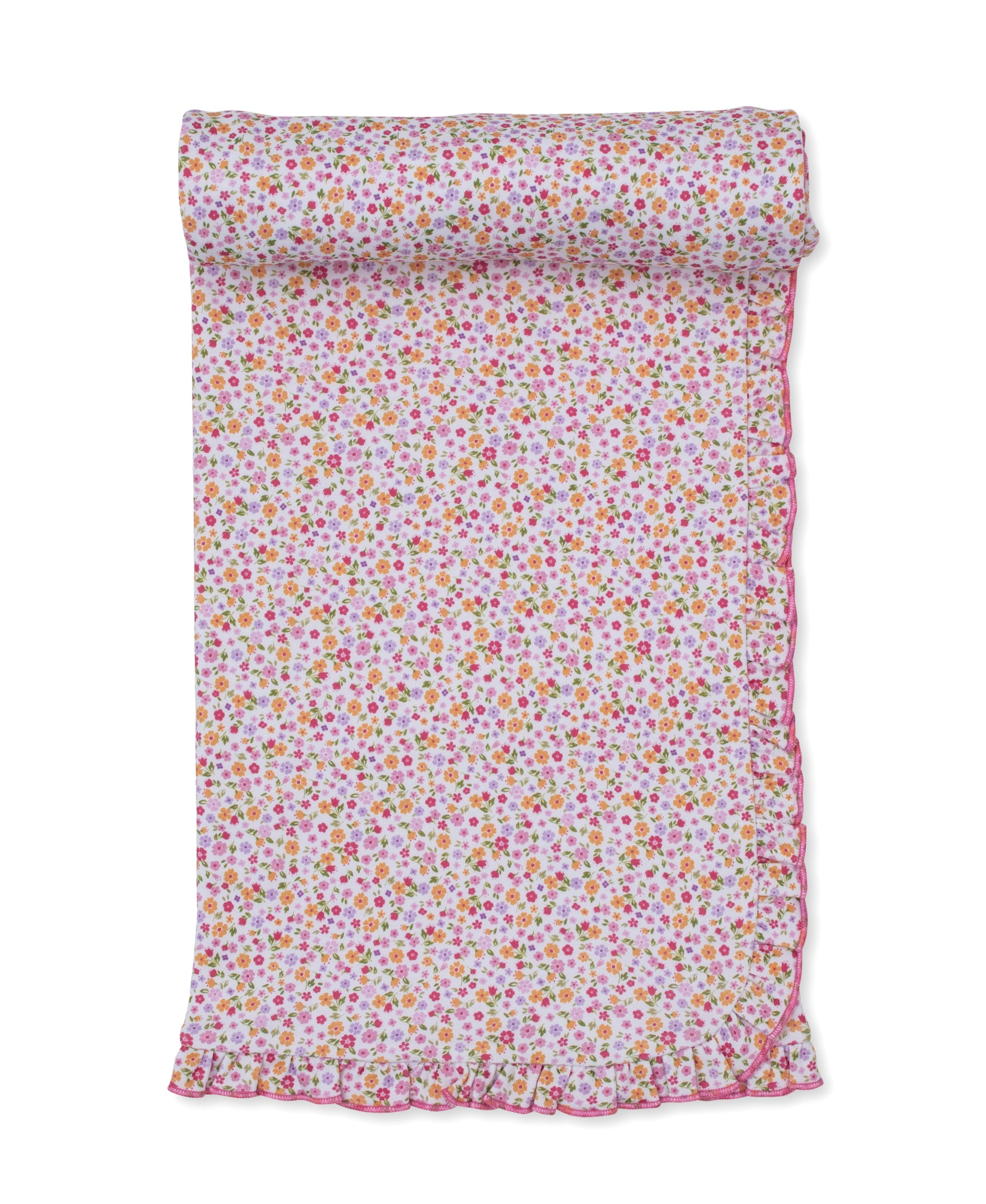 The Kissy Kissy Ruffle Blanket, featuring a charming floral pattern and pink ruffled edges, is shown partially rolled out on a white background—perfect for wrapping a little girl in cozy comfort.