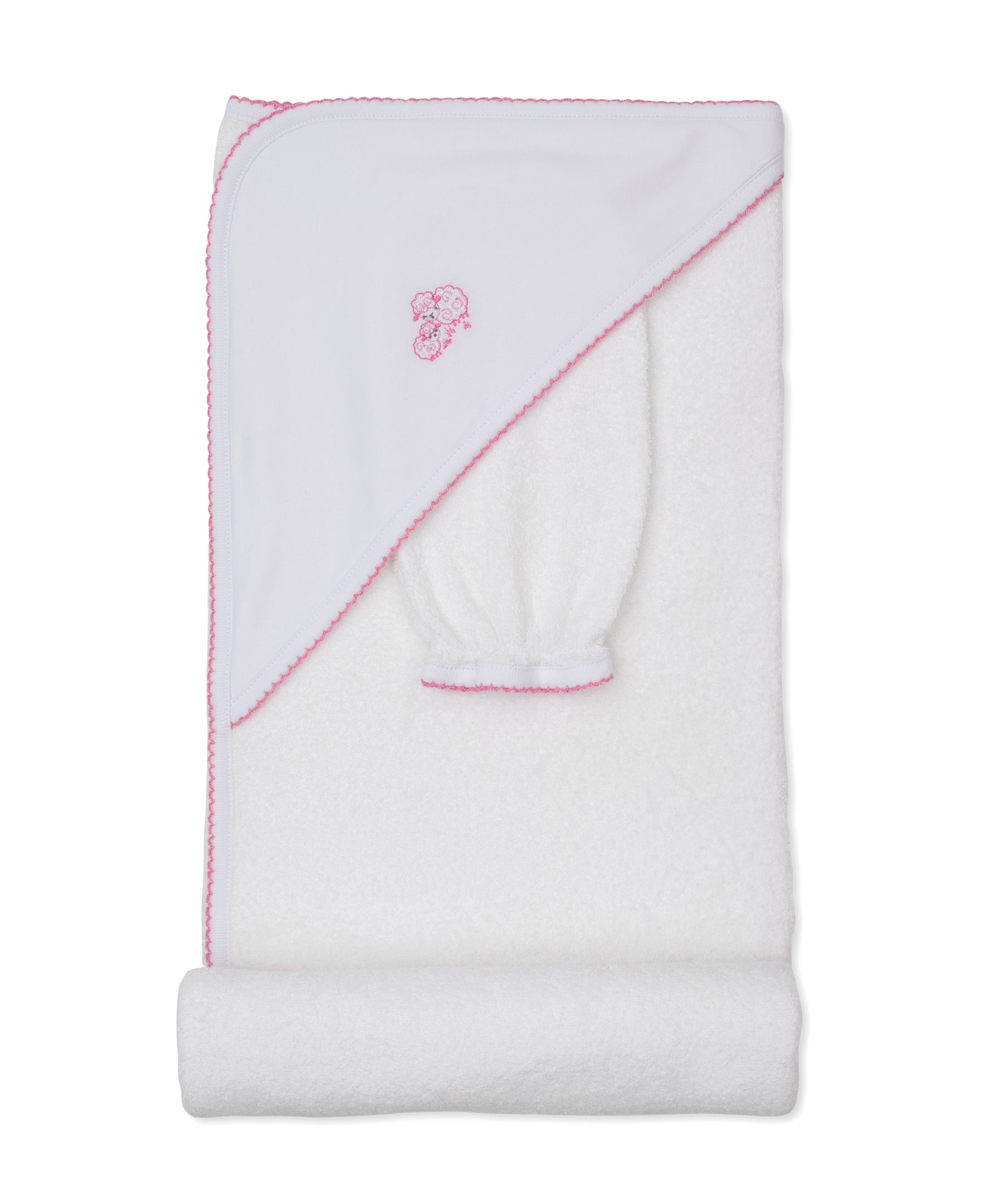 The Kissy Kissy Sweet Sheep Hooded Towel with Mitt features a white Pima cotton towel set trimmed in pink, with an embroidered sheep design on the hood. Displayed folded against a white background, the set includes a matching mitt—perfect for a gentle baby bath.