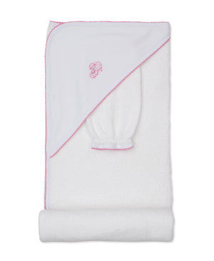 The Kissy Kissy Sweet Sheep Hooded Towel with Mitt features a white Pima cotton towel set trimmed in pink, with an embroidered sheep design on the hood. Displayed folded against a white background, the set includes a matching mitt—perfect for a gentle baby bath.