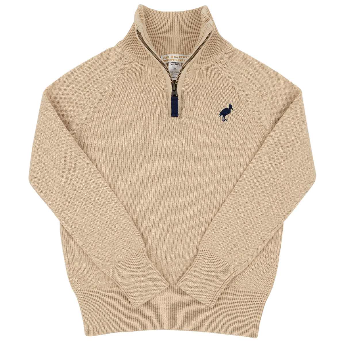 The Baby Boys’ and Boys’ Hayden Half Zip Sweater by The Beaufort Bonnet Company features a beige design with ribbed collar, cuffs, and hem, plus a small embroidered bird logo on the left chest—a classic cotton sweater for boys.