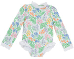 A long-sleeve Sarasota Surf Suit for baby girls by The Beaufort Bonnet Company, featuring elegant floral patterns and delicate lace trim on the collar, cuffs, and leg openings, inspired by timeless classic style.