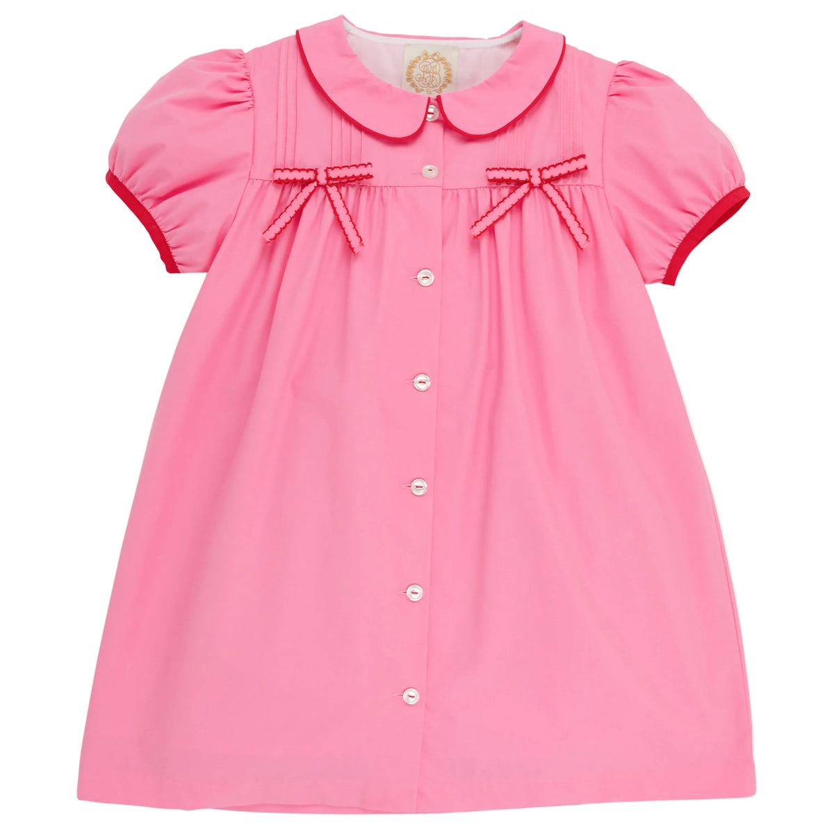 This charming dress—featuring short sleeves, a button-front design, Peter Pan collar, red trim, and two small red bows on the chest—resembles The Beaufort Bonnet Company’s Baby Girls’ and Girls’ Tabitha’s Teacher’s Pet Dress in their signature Hamptons Hot Pink.