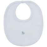 The Kissy Kissy Premier Puppy Paws Hand Emb. Striped Bib is a light blue baby bib made from soft Peruvian cotton, featuring subtle white stripes, a delicate hand-embroidered puppy in the center, and a convenient snap closure at the neck.