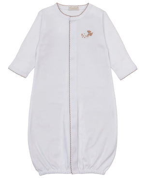 The Kissy Kissy Baby Premier Puppy Paws Hand Emb. Convertible Gown features long sleeves, brown trim, a front snap closure, and delicate hand embroidery on the chest. Made from ultra-soft Pima cotton, this gown offers both comfort and convenience for your little one.