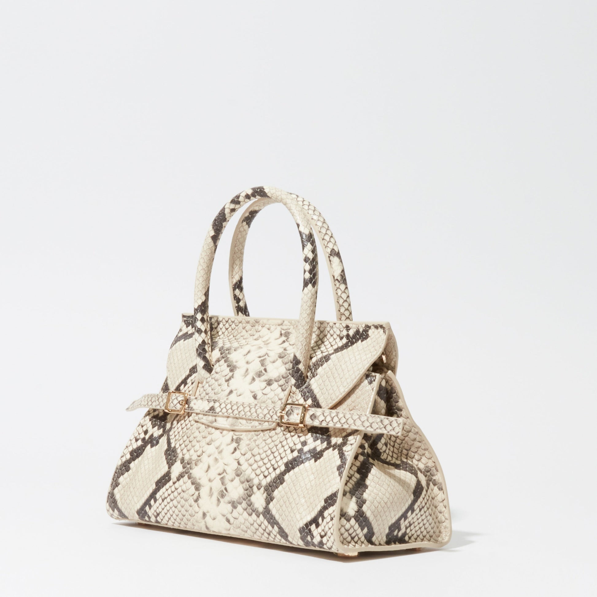 The Simkhai River Small Snake Top Handle Bag features beige and brown snakeskin, two top handles, and a decorative belt detail, shown against a plain white background.