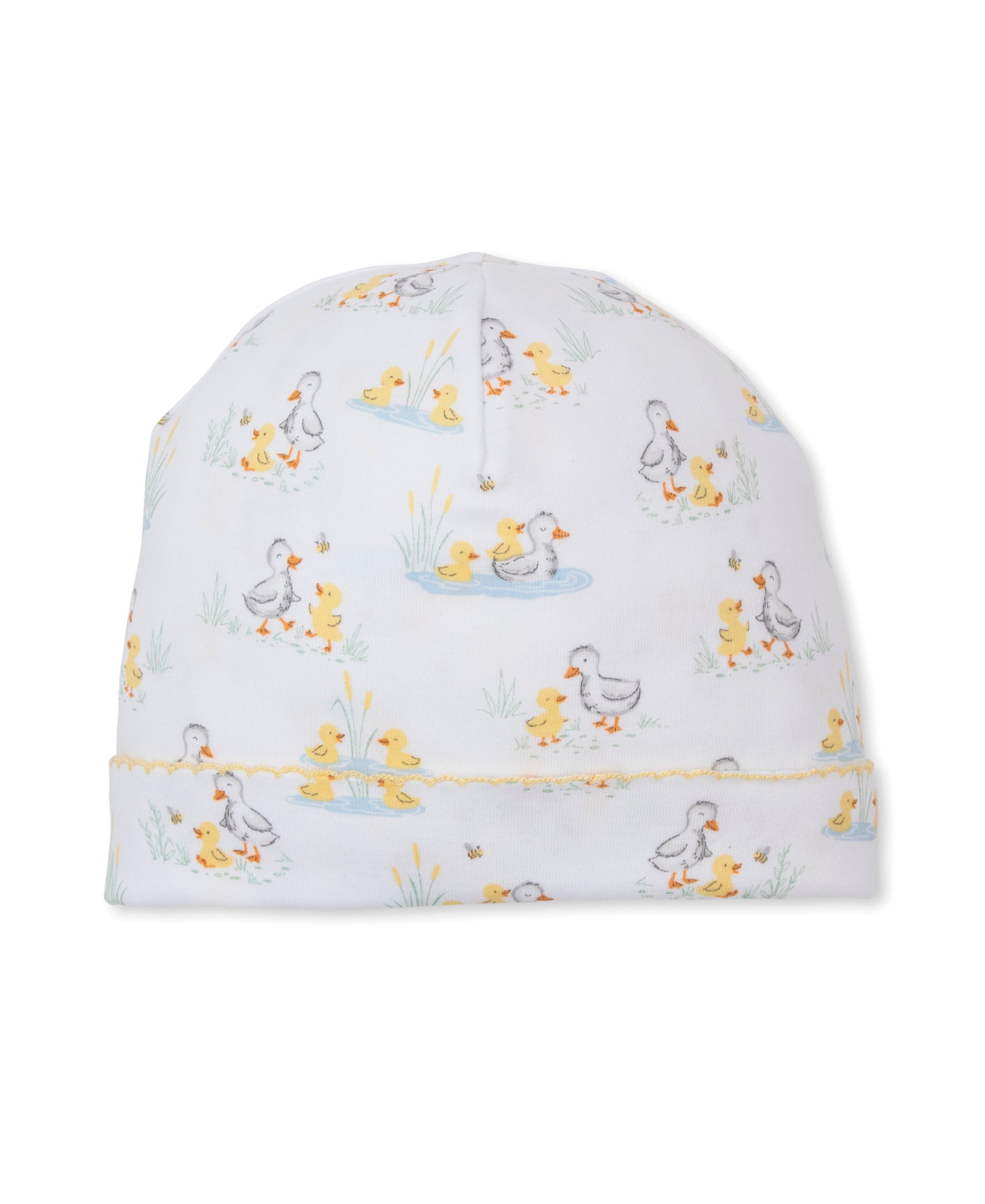The Kissy Kissy Baby Duck Pond Paddles Printed Hat is crafted from soft Pima cotton and showcases a delightful print of ducks and ducklings in yellow and gray, complete with pond and grass details. Finished with a scalloped yellow trim along the bottom edge, this cozy and stylish hat is perfect for your little one.