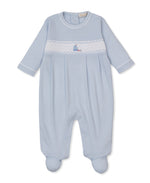 Dress your little one in the Kissy Kissy Baby Boys’ CLB Summer Medley Footie—a light blue, long-sleeve romper with footed bottoms. Made from premium Pima cotton, it features a white smocked chest panel adorned with a small embroidered sailboat at the center.