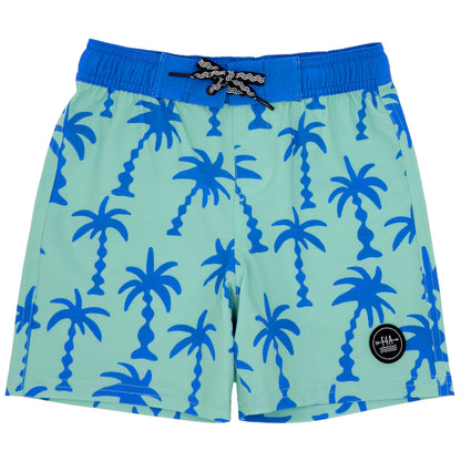 The Feather 4 Arrow Wavy Palm Boardshort by Feather 4 Arrow features light blue swim shorts adorned with blue palm tree patterns and includes a black circular logo on the left leg. These shorts are designed with 4-way stretch for maximum comfort and come with a dark blue waistband complemented by a black and white drawstring. Additionally, enjoy your sunny days with UPF50+ sun protection integrated into the fabric.