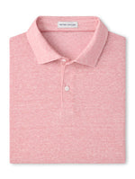 The Sanibel Polo by Peter Millar is a folded light pink linen-cotton shirt with a collar and two buttons, made from lightweight slub fabric—an effortless casual essential for any wardrobe.