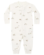 The Quincy Mae Baby Zip Long Sleeve Sleeper is a white onesie made from soft organic brushed jersey, featuring a diagonal zipper and a subtle pattern of small woodland animals and mushrooms in muted tones.