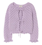 The Cozmo Girls' Ivy Tricot Cardigan features a lavender openwork design, eyelet details, long sleeves with ruffled cuffs, and three front tie closures.