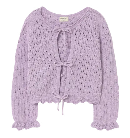 The Cozmo Girls' Ivy Tricot Cardigan features a lavender openwork design, eyelet details, long sleeves with ruffled cuffs, and three front tie closures.