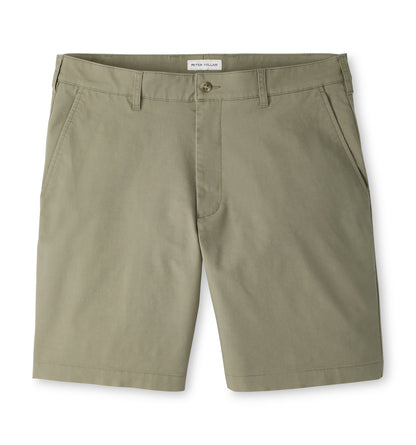 Peter Millar Crown Comfort shorts in olive green plain weave fabric, featuring a button fly, belt loops, and an 8″ inseam.