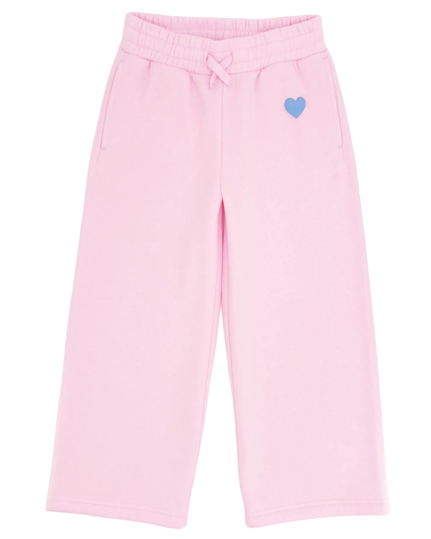 The Girls’ Cozy Sweatpant by Feather 4 Arrow features a light pink, wide-leg design with an elastic waistband, front pockets, flared bottoms, and a small blue heart detail on the left side.