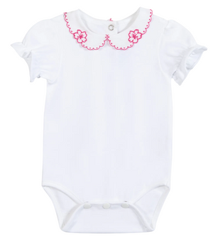 Dress your little one in the Tartine et Chocolat Baby Girls’ Peter Pan Collared Onesie—a white cotton romper featuring a charming scalloped Peter Pan collar with pink trim, delicate embroidered pink flowers, and short puff sleeves. Perfect as a summer outfit for baby girls, it also includes convenient snap buttons at the bottom and back for easy changes.