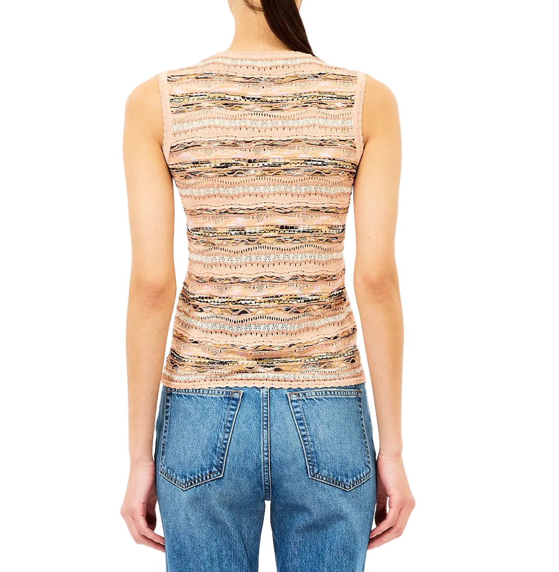 A person is shown from the back against a white background wearing the Ulla Johnson Alisa Knit Top, a slim fit beige patterned knit, paired with blue jeans.