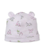 The Kissy Kissy Baby Safari Party Novelty Hat is a light pink baby hat made from soft Pima cotton, featuring charming safari party animal illustrations and two small fabric ears on top.