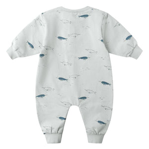The Quincy Mae Baby Boys' Relaxed Fleece Jumpsuit is a light grey, long-sleeve fall outfit with cuffs, easy-change snaps, and a cute blue and outline-drawn narwhal pattern.