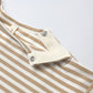 Close-up of the Quincy Mae Baby Boys' Long Sleeve Pocket Jumpsuit in beige and white stripes, featuring two metal snap buttons on the shoulder flap for easy changing.
