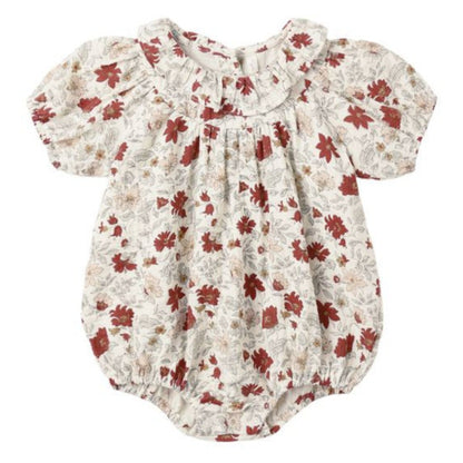 The Rylee & Cru Baby Girls' Lula Romper features short sleeves, a ruffle neck, red and beige floral print on white, and snaps at the bottom for quick changes.