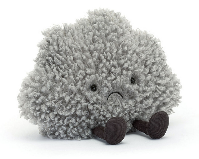 The Amuseables Storm Cloud by Jellycat is a soft, grey plush toy with a curly texture, black eyes, a small frown, and dark cylindrical legs, shown sitting on a white background.