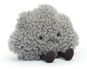 The Amuseables Storm Cloud by Jellycat is a soft, grey plush toy with a curly texture, black eyes, a small frown, and dark cylindrical legs, shown sitting on a white background.