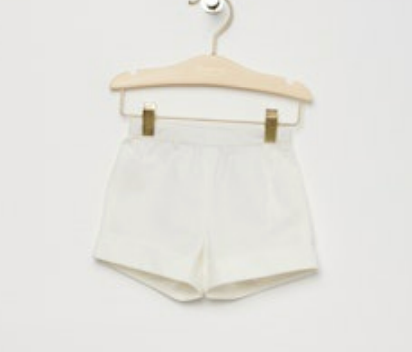 Bonpoint Baby Girls' and Girls' Ecandy Shorts in white poplin, displayed on a wooden hanger against a plain white background.