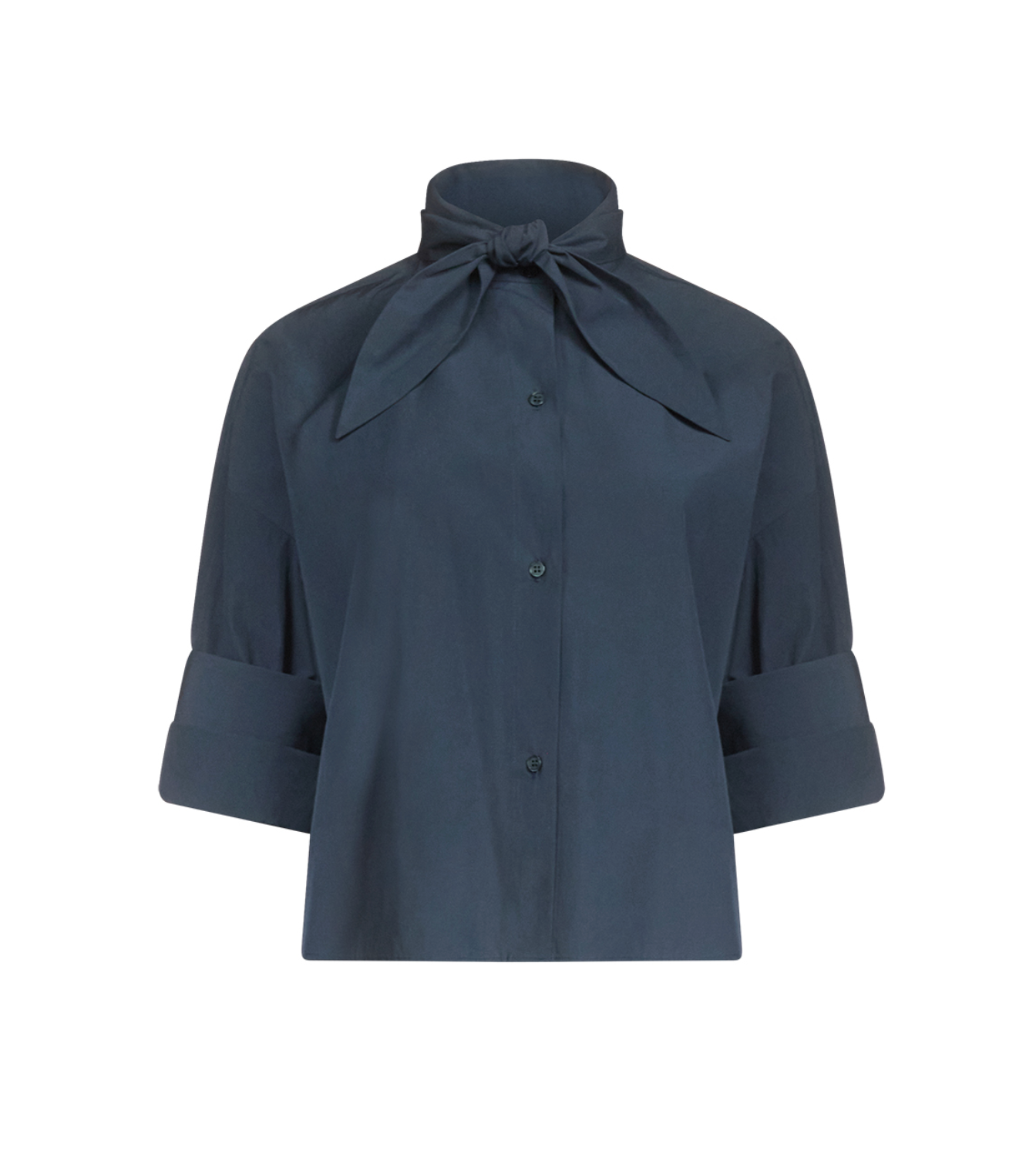 The TWP Tie One On Shirt is a dark blue, vintage-washed poplin button-up blouse featuring elbow-length sleeves and a tied bow collar, shown against a white background.