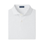 The Fermata Performance Jersey Polo by Peter Millar is a white collared shirt with a subtle blue dotted pattern, two buttons, and four-way stretch for comfort. "Peter Millar" is featured on the inside collar tag.