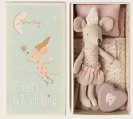 Introducing the Maileg Tooth Fairy Mouse in Matchbox - Little Sister: a delightful boxed set featuring a little sister mouse dressed in a tutu, ready to collect lost teeth. Nestled in her cozy matchbox bed with a pillow and blanket, she comes with a heart-shaped tooth box. The illustrated lid reads "Dream & Tooth Fairy," showing the mouse wearing her charming hat and holding a wand.