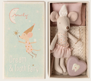 Introducing the Maileg Tooth Fairy Mouse in Matchbox - Little Sister: a delightful boxed set featuring a little sister mouse dressed in a tutu, ready to collect lost teeth. Nestled in her cozy matchbox bed with a pillow and blanket, she comes with a heart-shaped tooth box. The illustrated lid reads "Dream & Tooth Fairy," showing the mouse wearing her charming hat and holding a wand.