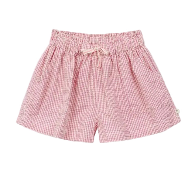 The Arsene & Les Pipelettes Girls' Vichy Short features pink gingham seersucker fabric, an elastic waistband with a drawstring tie, and convenient side pockets—perfect for sunny days, shown here on a white background.