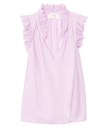 The Bexie Top by Xirena is a sleeveless light purple popover with a deep V-neckline and ruffled collar, crafted from lightweight fabric for an airy feel.