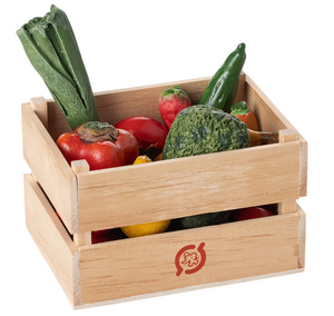 The Maileg Veggies and Fruits - Miniature set features a wooden crate filled with assorted toy vegetables, ideal for dollhouse accessories or imaginative play. This charming collection includes a leek, pepper, avocado, and chili—miniature organic fruits and vegetables—artfully presented on a white background.