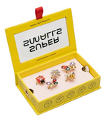 The Super Smalls Garden Get-Together Ring Set comes in a yellow box with "SMALL BUT MIGHTY" on the lid, featuring five colorful, insect-themed butterfly and ladybug rings on a pink tray inside.