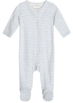 Introducing the Serendipity Newborn Rib Stripe Bodysuit: a cozy, long-sleeve footed onesie made from GOTS-certified organic cotton, featuring soft light blue and white horizontal stripes and convenient snap buttons down the front for easy changes. Enjoy comfort and peace of mind for your little one with this thoughtfully designed bodysuit.