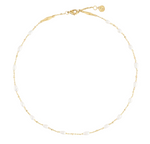 Anabel Aram Milos Multi Beaded Necklace featuring an 18k gold plated chain interspersed with small, oval white beads.