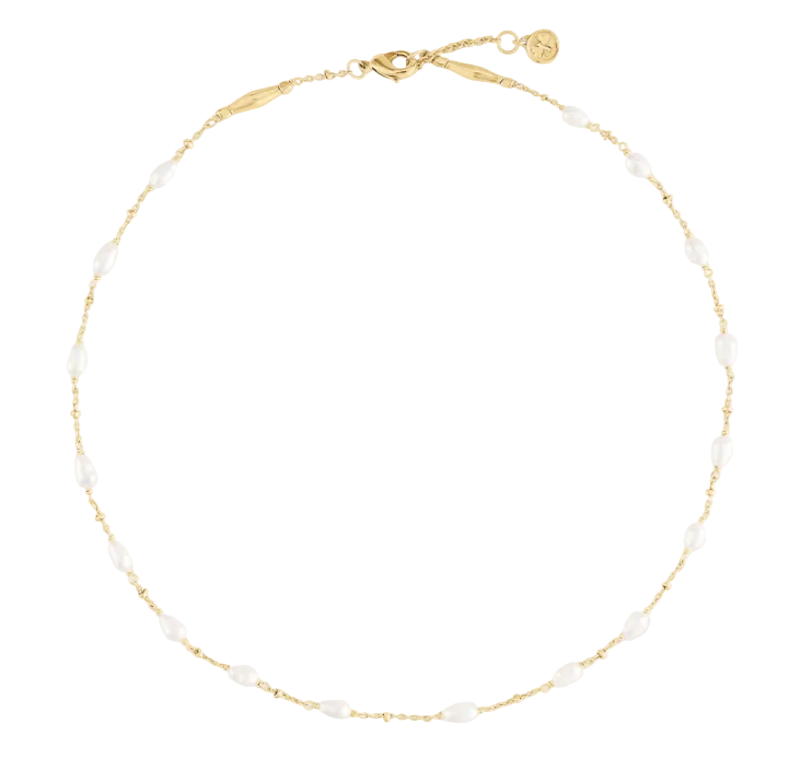 Anabel Aram Milos Multi Beaded Necklace featuring an 18k gold plated chain interspersed with small, oval white beads.