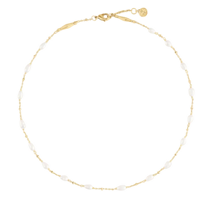 Anabel Aram Milos Multi Beaded Necklace featuring an 18k gold plated chain interspersed with small, oval white beads.