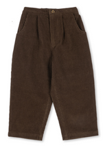 Konges Slojd Baby Boys’ and Boys’ Remy Pants in dark brown corduroy with an elasticated waistband, a single front button, and a relaxed fit.