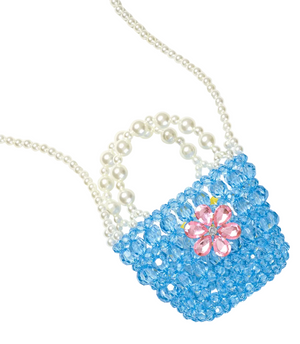 The Opening Night Beaded Purse by Super Smalls is a small blue beaded bag featuring pearl handles, a crossbody strap, and a pink crystal flower detail in the center.