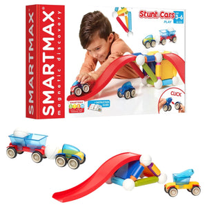 A child plays with the Smart Games SmartMax Basic Stunt set, building toy cars and a ramp from colorful magnetic pieces. Box and assembled toys are shown.